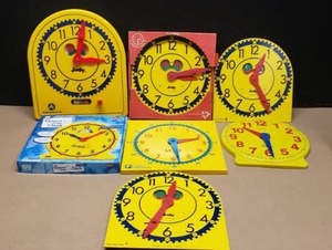 lot 104 image: Lot of 7 Classroom Learning Geared Clocks