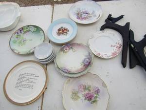 lot 9 image: Plate lot including, fruit design, Haviland flower plates, plate holders and more