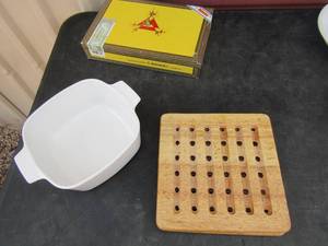 lot 104 image: Montecristo yellow cigar box clock, 8 cup measuring cup, corning ware bowl, 2 trivets