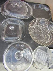 lot 106 image: Pyrex pie plate, fruit dcor clear glass bowl, various clear lids, egg plate and more