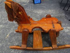 lot 113 image: solid wood childrens rocking horse, may adults have been on it,  heavily constructed  35x44x17