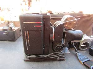 lot 138 image: Beldin vintage movie camera in case AT1,Canon camera with a 55 mm50mm lense in case