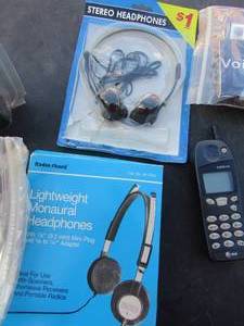 lot 140 image: radio shake light weight headphones,sterio headphones, nokia phone with charger unknown working condition