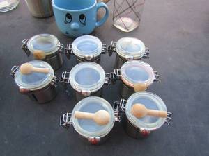 lot 141 image: 8 mini canisters with spoons, 2 coffee cups, green fido canister, tumbler and more
