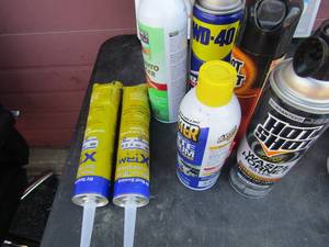 lot 155 image: various used cans bug spray, spiders,roaches,flys and more. 2 new roof sealant for cocking gun
