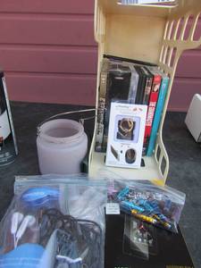 lot 156 image: dvds my phone ring hook new, invisable shield for a motorola phone, phone pins, baf of ear buds
