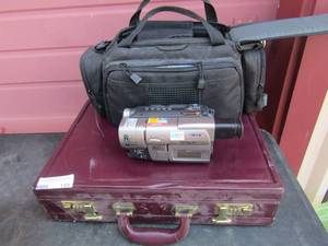 lot 159 image: maroon breifcase and a sony camcord with case and charger