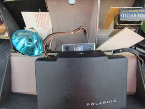 lot 162 image: polaroid camera in case with flash and more, peperwprk included