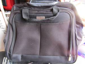 lot 190 image: protg black rolling travel bag, siler metal shoe rack needs to be put together