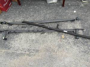 lot 210 image: a metal set of queesn size bed rails plus middle insert for balnce