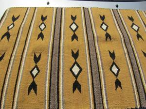 lot 269 image: NATIVE AMERICAN  NAVAJO INDIAN  Rug brown, white, black, and grey in color 45 x 25