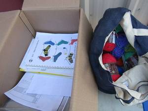 lot 273 image: box of lion brand modern baby yarn all different colors, yarn pattern books