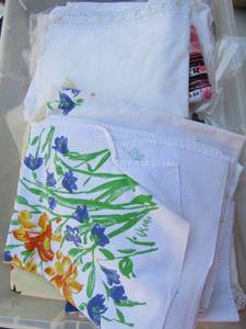 lot 294 image: small clear tub of table cloth covers, place matts most by vera