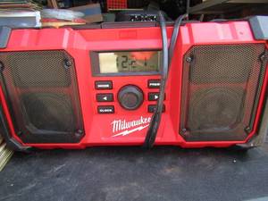 lot 301 image: Milwakee amfm radio with aux player, wall plug included but not battery