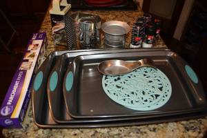 lot 170 image: Baking Lot Rachel Ray Cooking Sheets, Sifter, Grater, Parchment Paper, Salt and Pepper