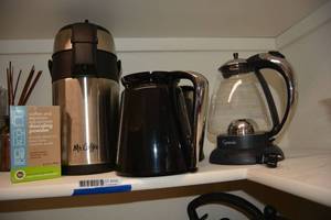 lot 206 image: Coffee Pots, descaling powder, and Capresso Pot