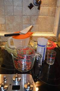 lot 191 image: Pyrex Pie Plates, Measuring Cups, Storage Containers, and Pampered Chef Pie Server
