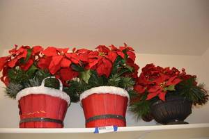 lot 89 image: 3 Poinsettia Flower Arrangements (2 with Santa Bushel Baskets)