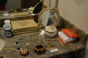 lot 334 image: Misc. Jewelry, Trinket Box with Buttons, Vintage Vanity Mirror, Wall Plaques and More