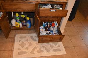 lot 335 image: Bathroom Cleaners, Rug,  Mouthwash, Shaving Kit and Misc. Items