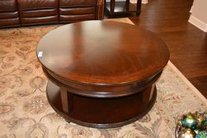 lot 123 image: 40 Round Table with Wheels by Bassett Furniture