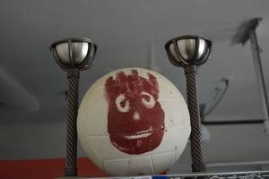 lot 395 image: Wilson Replica Volleyball from Cast Away Movie and Pair of Torch Holders