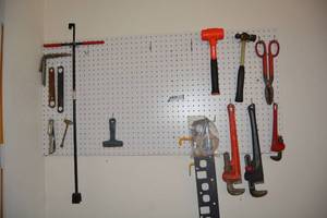 lot 436 image: Tools Wrenches, Hammers, Water Wrench and More (peg Board Stays but Extra Hooks are Included)