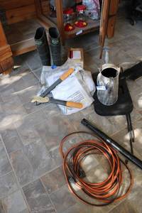 lot 461 image: Boss Boots, Garden Trimmer, Watering Can, and Extension Cord