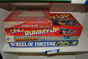 lot 56 image: Board Games Scrabble, Uno Rummy-Up, Battleship, and Wheel of Fortune