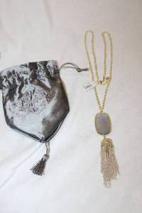 lot 731 image: Jewelry Signed Kendra Scott dangle necklace with attached retail tag, Rayne Gold 213, Storage pouch
