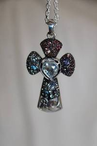 lot 737 image: Jewelry Signed Brighton Necklace. Crystal adorned cross pendant. Heart shaped clasp with Brighton B hang tag.