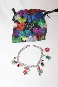 lot 738 image: Jewelry Signed Brighton Holiday Charm Bracelet. Lobster clasp with Brighton B hang tag.