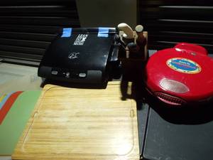 lot 18 image: George Forman Electric Grill, with Owners Manual, Cutting Board with Multiple Changeable Plastic Mats, Electric Quesadilla Maker, with Owners Manual, and Knife Block with Knives
