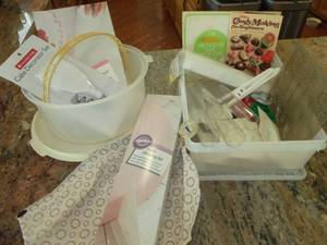 lot 64 image: Candy Making Supplies (Molds, Thermometer, Instructional Book) & Cake Holder, Wilton Icing supplies (NIB) & Cake Divider (NIB)