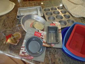 lot 63 image: Baking Dishes, Metal and Silicone Some NIB, Heart Shaped Plastic Box