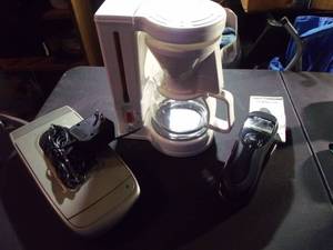 lot 135 image: Vintage Gevalia Coffee Pot (works), New Emerson Caller ID Phone (no connection cords), and Vintage VHS Rewinder