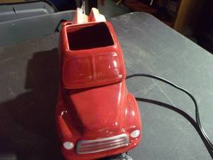 lot 139 image: Wax Burner in 3-piece part In the shape of an old truck. Truck Cab is Actually the Warmer, Back of Truck holds extra Wax. This has a Timer to Turn Its Self off