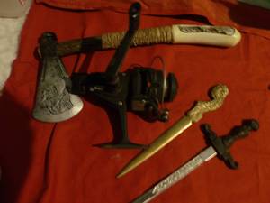 lot 150 image: Mixed Lot - Decorative Indian Hatchet, Vintage Letter opener, and Fishing Reel
