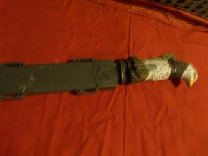 lot 153 image: Eagle Handled Knife with beautiful Engraving on the Blade and hard plastic sheath