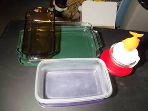 lot 258 image: Variety of Baking Dishes, Covered Cake Pan, Loaf Pan, and Storage Bowls. Fish Pot Handle Holder,... See Pictures