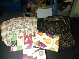 lot 259 image: Dinner Table Placemats, two sets reversable, Decorative Vinyl Tablecloths, and Complete Wine Pairing Book
