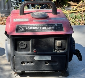 lot 25 image: Storm Cat 700 Running Watts 900 Peak Watts Portable Generator W 2 HP Two Stroke Gas Engine