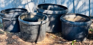 lot 52 image: Four 19 x 15 &amp 23 x 18 Planter Pots