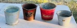 lot 105 image: Assorted Vintage Buckets W Lone Star Steakhouse &amp Budweiser