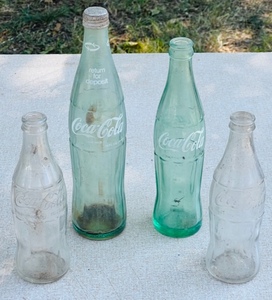 lot 143 image: Four Vintage Coca-Cola Bottles