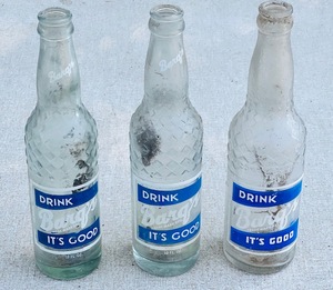 lot 144 image: Three Vintage Barqs Root Beer Glass Bottles