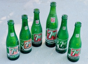 lot 145 image: Six Vintage 7UP Glass Bottles