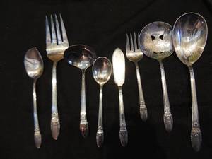 lot 388 image: 1847 ROGERS BROS. FIRST LOVE I.S. WEDDING SILVER 03121939  SERVING PIECES - LG MEAT FORK, SERVINGCASSEROLE SPOON, LADEL, BUTTER KNIFE, PIERCED SPOON,CHIPPED BEEF FORK, JELLY SERVING SPOON,  SUGAR SHELL,