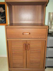 lot 49 image: Brown microwave table with bottom storage 482519