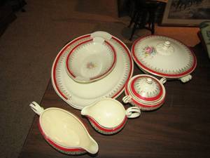 lot 8 image: Taylor Smith Red and Gold China   Serving PIECES includes Gravy boat, VEGETABLE BOWL, PLATTER , Covered CASSEROLE, Sugar and Creamer